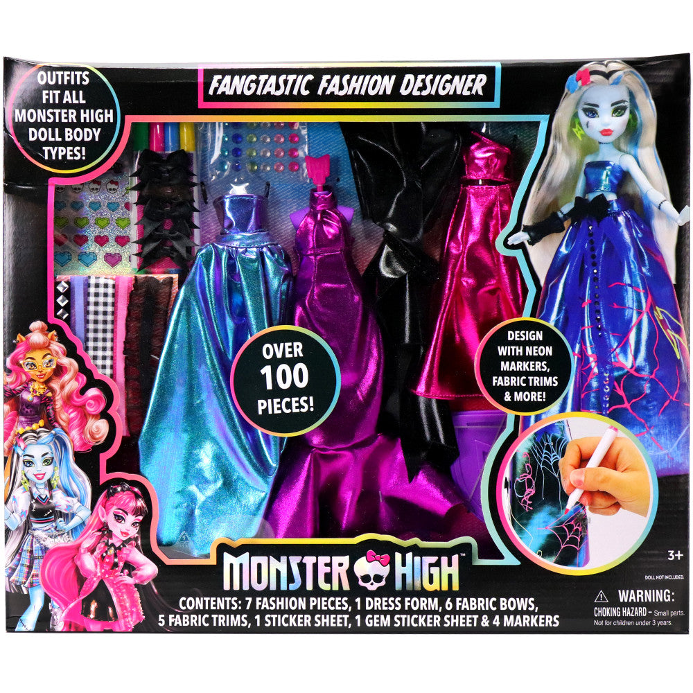 Monster High Fangtastic Fashion Designer kit showing doll with blue and neon pink outfit, colorful fabric pieces, markers, stickers, and design accessories on b