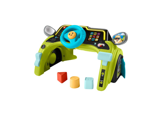 Lime green activity center with blue steering wheel, dashboard with buttons and icons, side mirrors, and three shape sorter pieces in red, yellow, and light blu