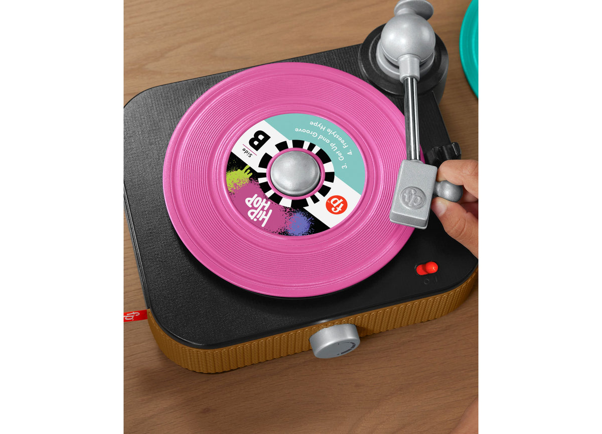 Fisher-Price Rockin' Record Player pink turntable toy with colorful record and silver tonearm