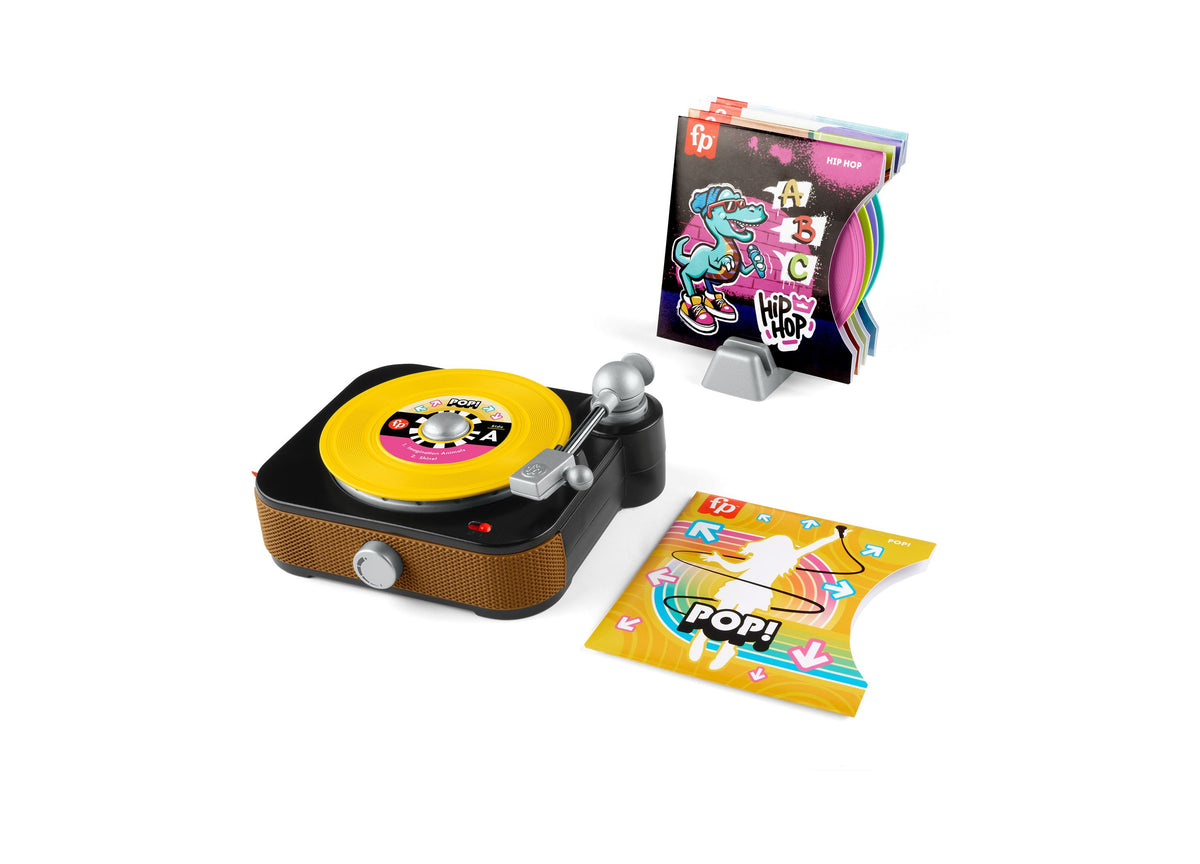 Fisher-Price Rockin' Record Player with yellow record, includes 6 colorful records and display stand