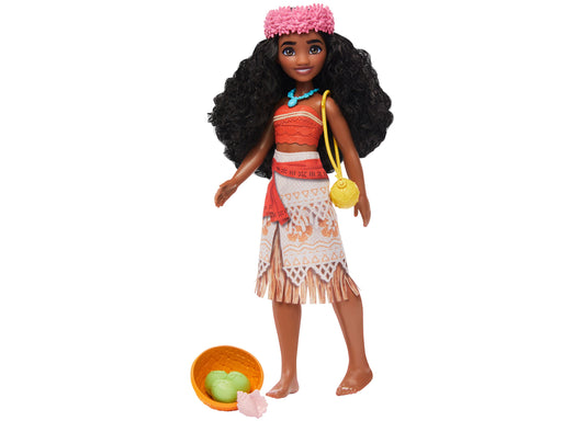 Disney Princess Moana fashion doll with long black curly hair, pink flower headpiece, red and white patterned dress, blue necklace, yellow shoulder bag, and acc
