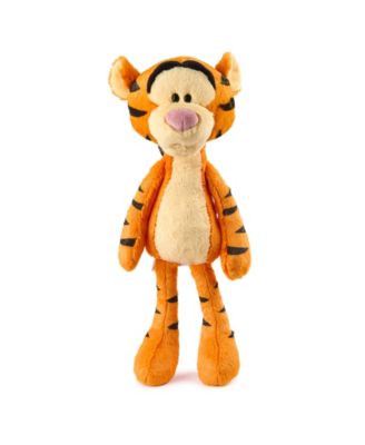 Orange and black striped plush tiger with cream-colored belly, black nose, and long legs standing against plain background