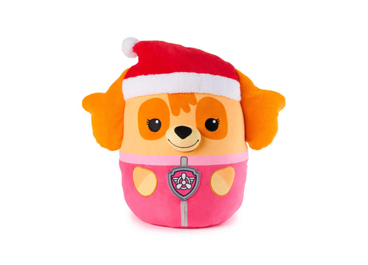Paw Patrol Skye plush wearing red and white Santa hat, cream and orange face, orange ears, pink body with paw pad details and shield badge