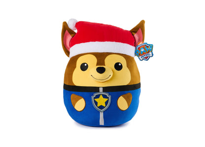 Paw Patrol Chase plush toy wearing red and white Santa hat with brown ears and yellow face, blue uniform with star badge