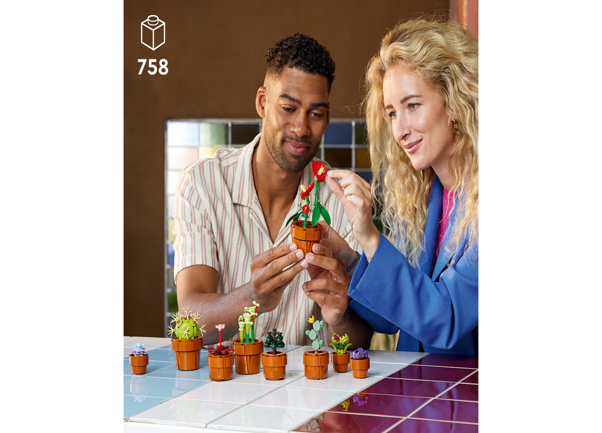 LEGO Icons Tiny Plants 758-piece set with 9 miniature potted plants in terracotta pots, displayed on table