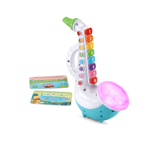 Jazzy Sax interactive musical toy with colorful numbered buttons, green mouthpiece, pink light-up bell, turquoise base, and two song cards included
