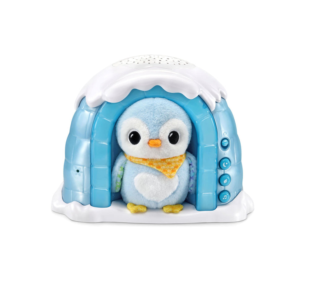 Blue and white igloo-shaped toy with plush light blue penguin wearing orange scarf inside, control buttons on side