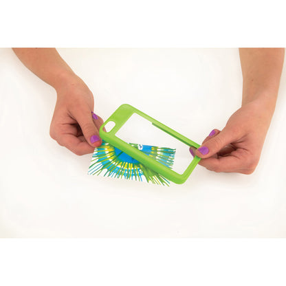 Child's hands holding green phone case with blue and yellow brush bristles attached, modeled by a child