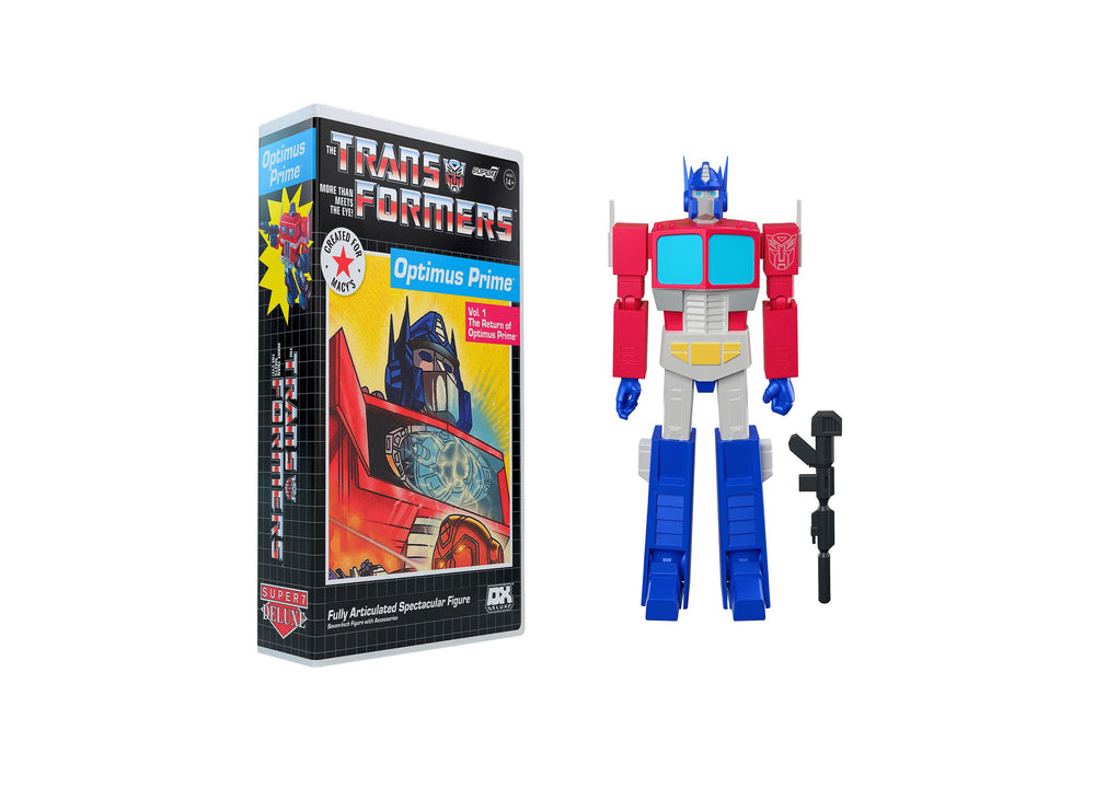 Transformers Optimus Prime 7-inch action figure with VHS-style packaging, shown with figure in robot mode featuring red, blue, and gray coloring, alongside blac