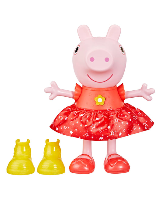 Pink Peppa Pig doll with smiling face, wearing red dress with white stars and yellow flower detail, red shoes, arms outstretched, with two yellow shoe accessori
