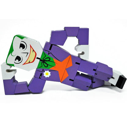 DC Comics Joker Wood Warriors 8-inch collectible action figure with purple articulated body, white hands, and smiling Joker face with green hair and orange star