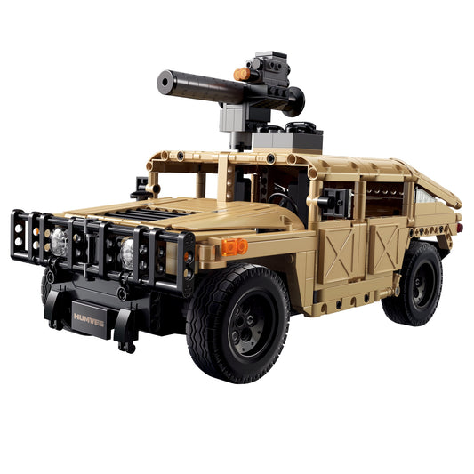 Tan and black HUMVEE military vehicle building set with mounted black turret and gun on plain background