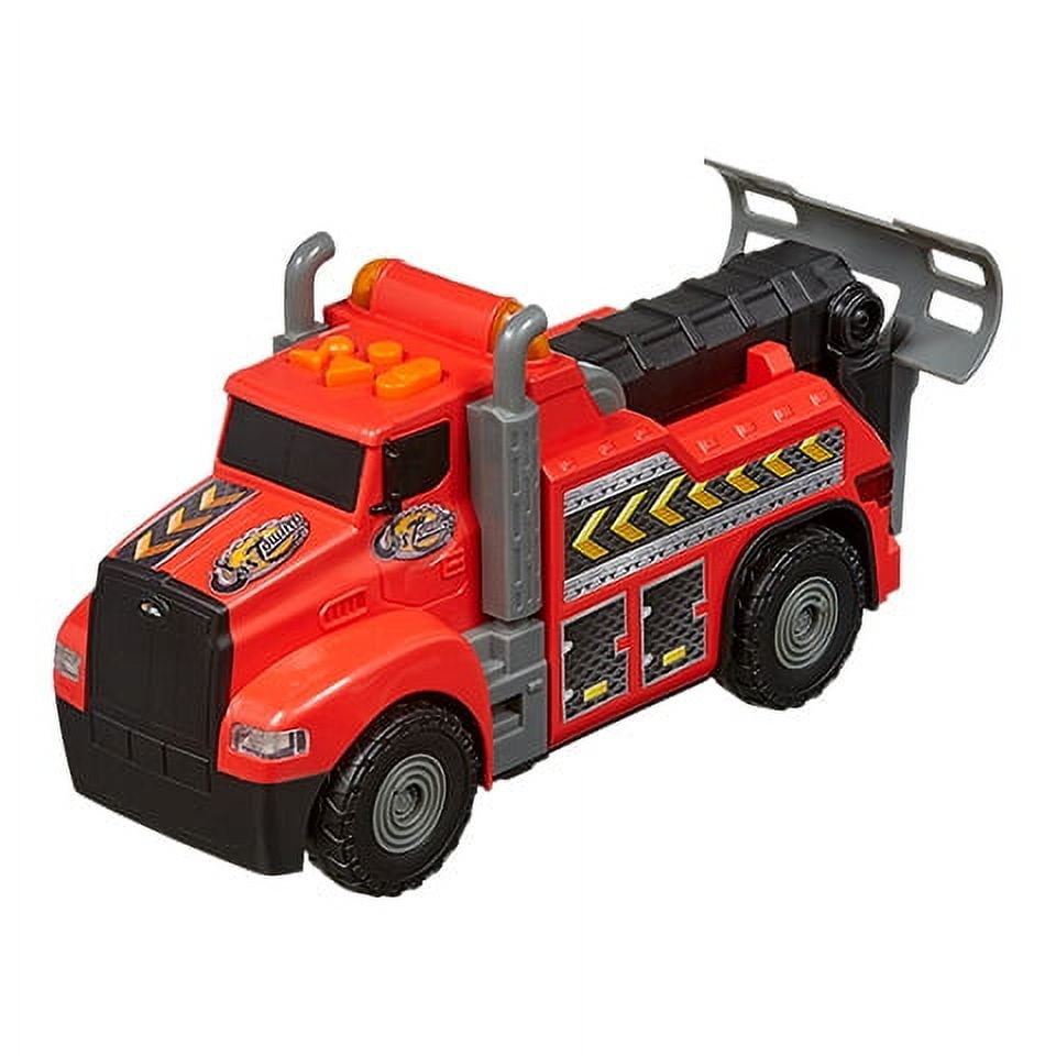 Red and black motorized RC tow truck with yellow and silver stripe detailing, black wheels, gray hydraulic arms, and open bed cargo area on plain white backgrou