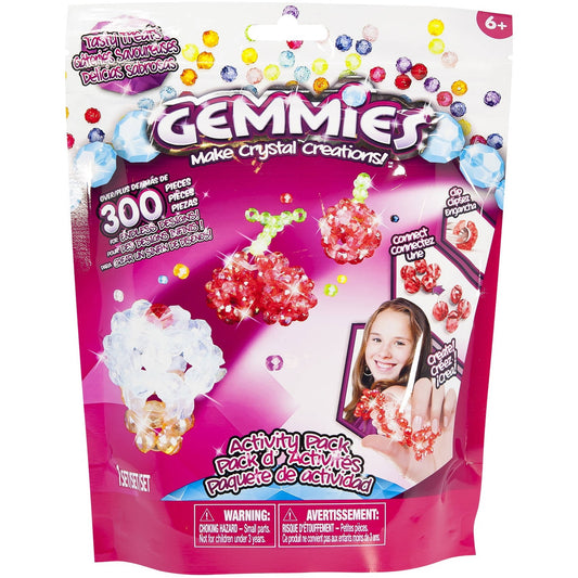 Gemmies Activity Pack Tasty Treats craft kit package showing 300 colorful crystal beads and finished sparkly creations modeled by a child, age 6+