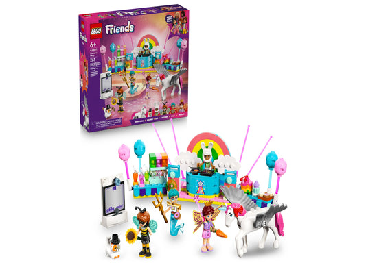 LEGO Friends Costume Party with Unicorn Fairy Set showing colorful stage with rainbow arch, minifigures, fairy character, unicorn, and accessories on plain back