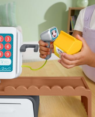 Fisher Price Laugh and Learn Count and Shop Cash Register toy with scanner, yellow coin, and colorful number pad