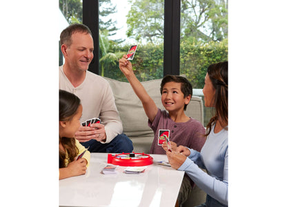 Mattel UNO Spin Classic Card Game with red spinner and cards, family playing together