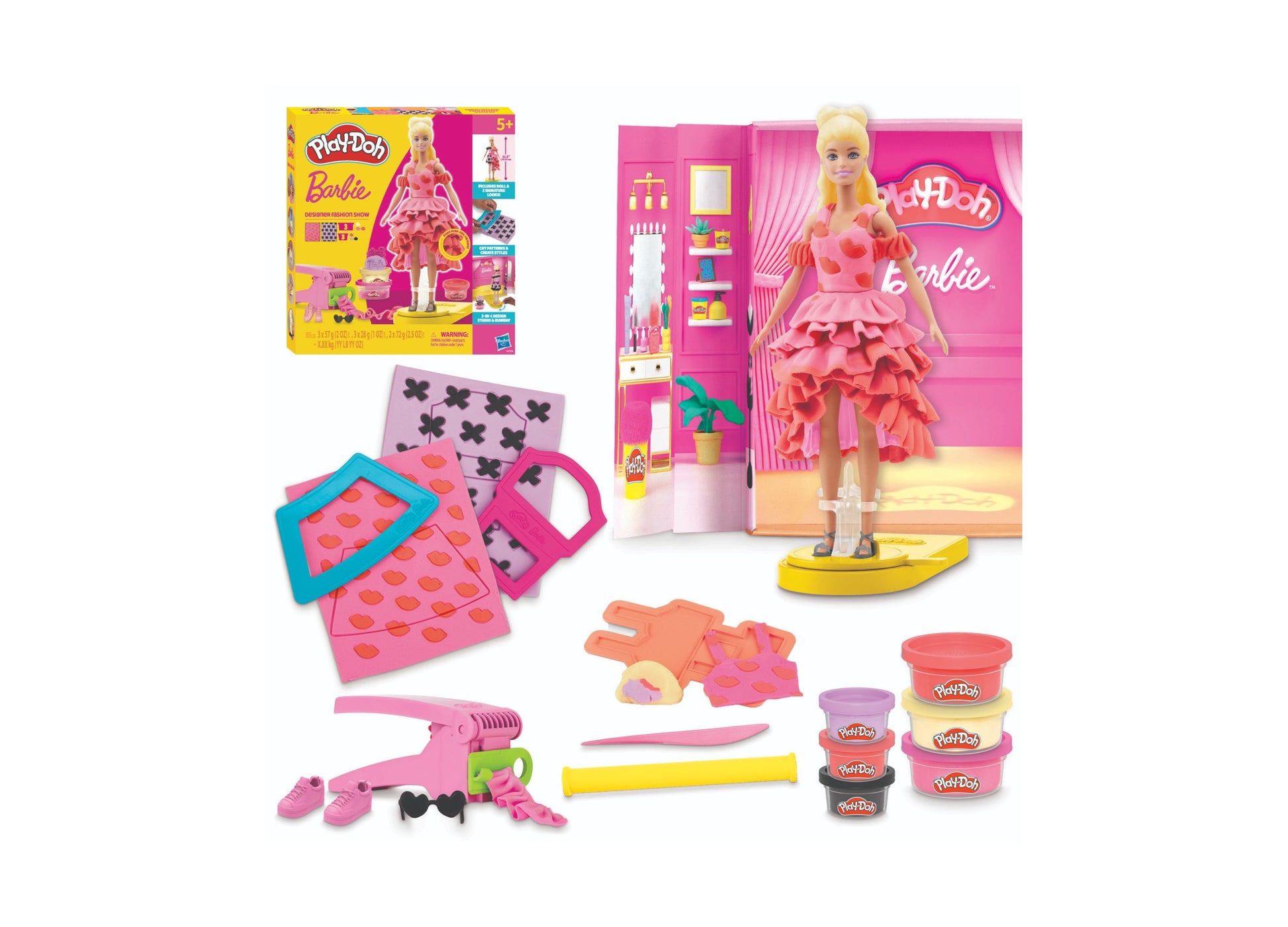 Play-Doh Barbie Designer Fashion Show Playset with blonde Barbie doll in pink ruffled dress, fashion design mats, hair styling tool, clothing pieces, and multip