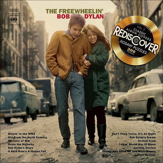 The Freewheelin' Bob Dylan 300-piece jigsaw puzzle box featuring vintage album cover art with two people on a city street, includes gold vinyl record redescover