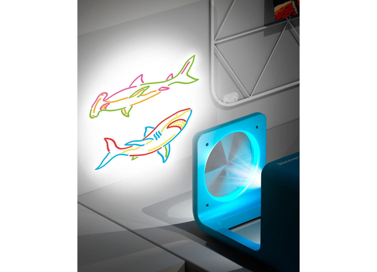 Discovery Kids Doodle Projector Light Art Station projecting colorful neon shark drawings on wall