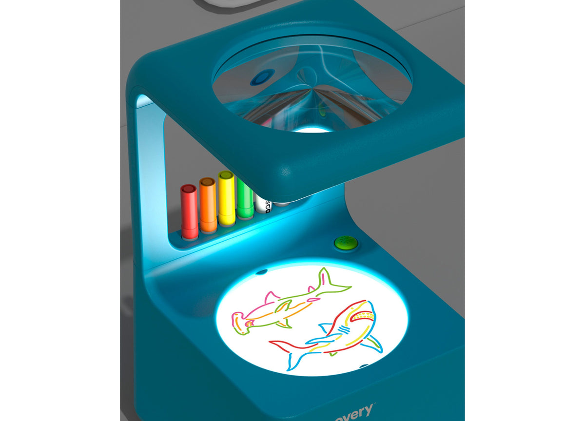 Discovery Kids Doodle Projector Light Art Station with teal housing, colorful markers, and illuminated drawing disc f...
