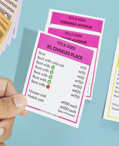 Monopoly Classic Edition property cards showing St. Charles Place title deed with pink header and rent prices