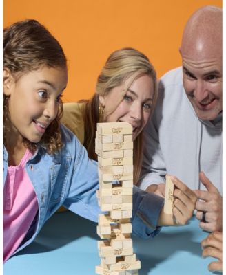 Jenga Classic Hardwood Block Game with three players stacking blocks