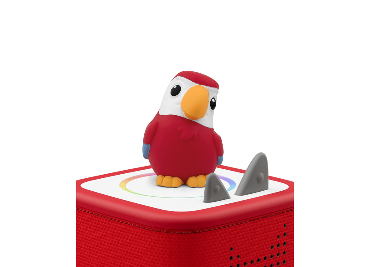 Red parrot figurine with white head and orange beak