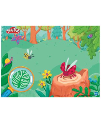 Play-Doh Light and Look Microscope Playset with nature-themed playmat featuring colorful plants, insects, and flowers...