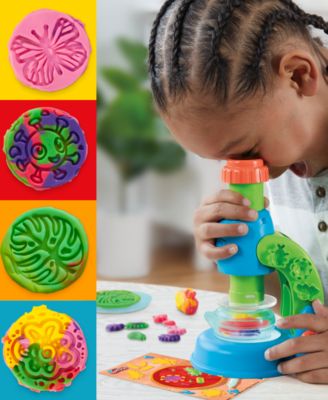 Play-Doh Light and Look Microscope Playset with colorful molds, blue light-up microscope, and activity cards