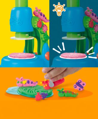 Play-Doh Light and Look Microscope Playset with blue microscope, green base, pink petri dish, and colorful Play-Doh c...
