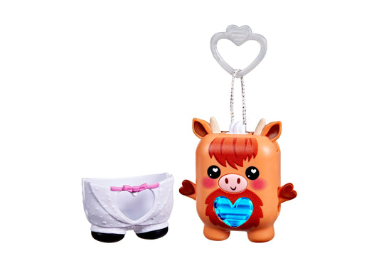 Orange cow-shaped interactive pet toy with red hair, black eyes with white hearts, pink nose, blue holographic heart on chest, and gray heart-shaped clip attach