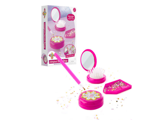 DIY bling compact brush diamond painting kit with pink containers, mirror, brush, and colorful rhinestones scattered on white background