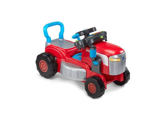 Red and silver interactive ride-on tractor toy with blue handle, black wheels, and attached mower attachment on plain white background