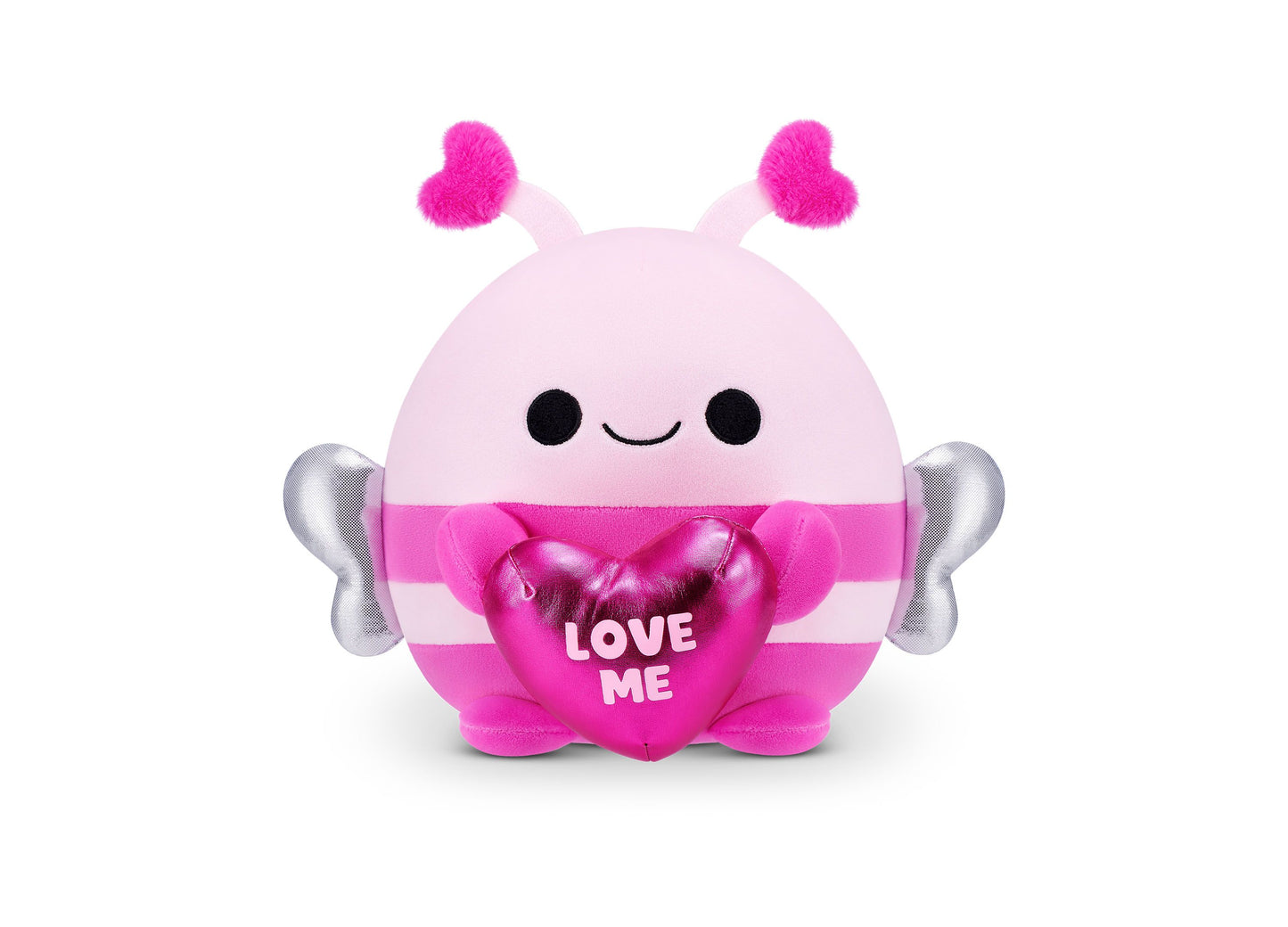 Pink and magenta plush Snackles bumblebee with fuzzy hot pink antennae, silver wings, black dot eyes, closed smile, and heart-shaped accessory reading LOVE ME