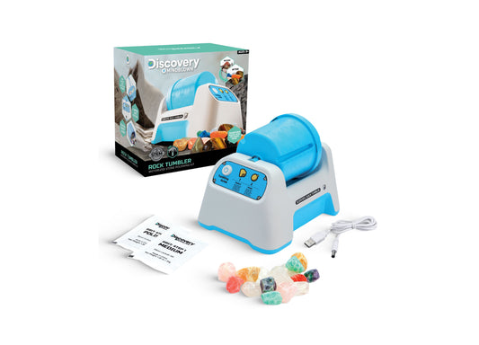 Discovery #MINDBLOWN Rock Tumbler motorized stone polishing kit with blue and white machine, USB cable, instruction guides, and colorful polished stones