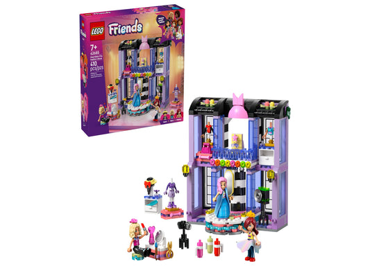LEGO Friends Heartlake City Fashion Show building set with purple and blue modular building, pink roof dome, minifigures, and accessories including camera and f
