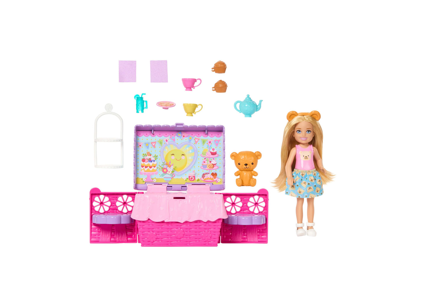 Barbie Club Chelsea tea party playset with pink pop-up furniture, small doll with blonde hair wearing pink top and blue skirt, tan teddy bear, and accessories i