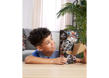 Boy opening Jurassic World Dino Reveal Deluxe Dinosaur Action Figure with dinosaur egg packaging