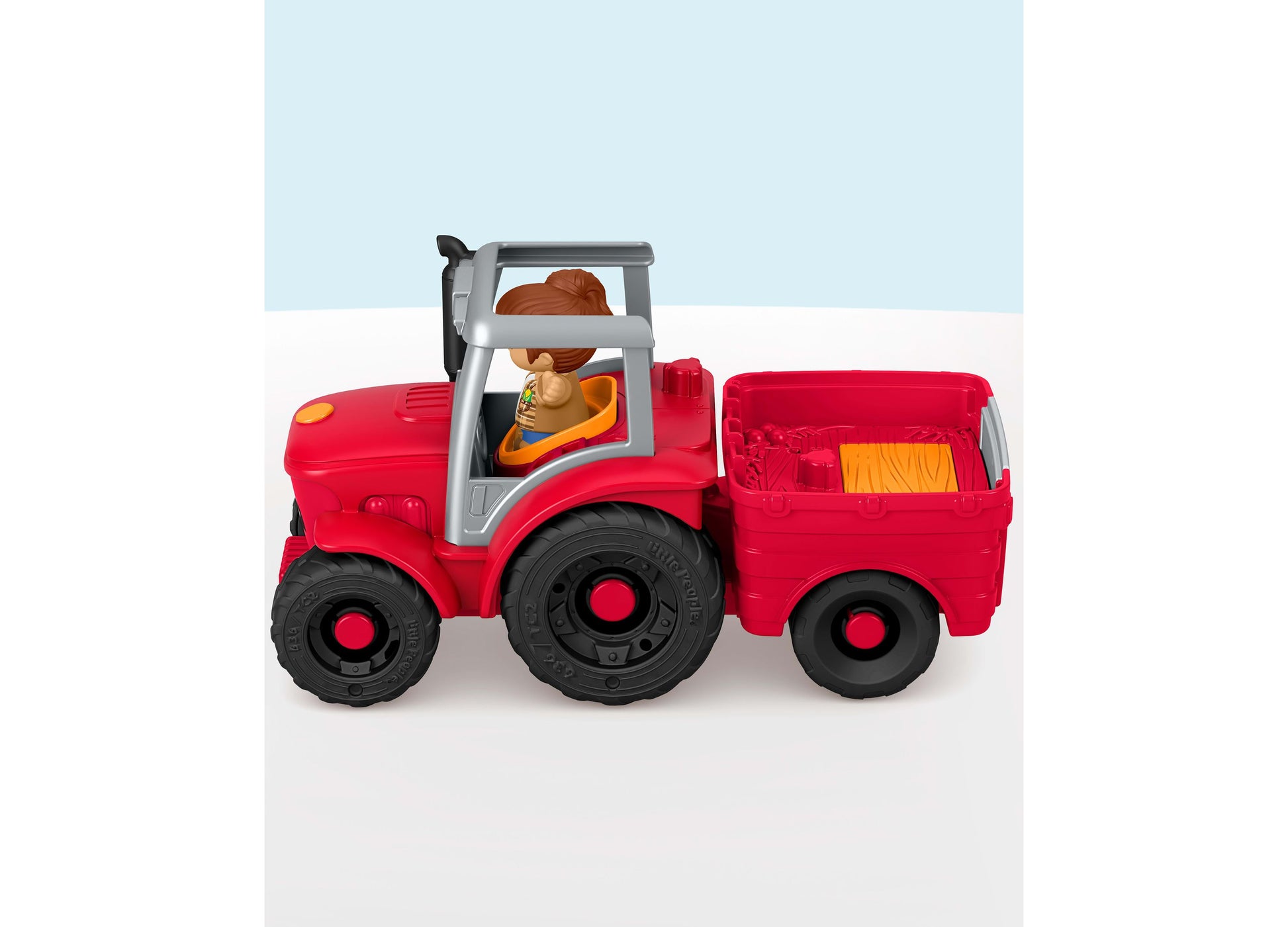 Fisher Price Little People red tractor with farmer figure and cargo trailer