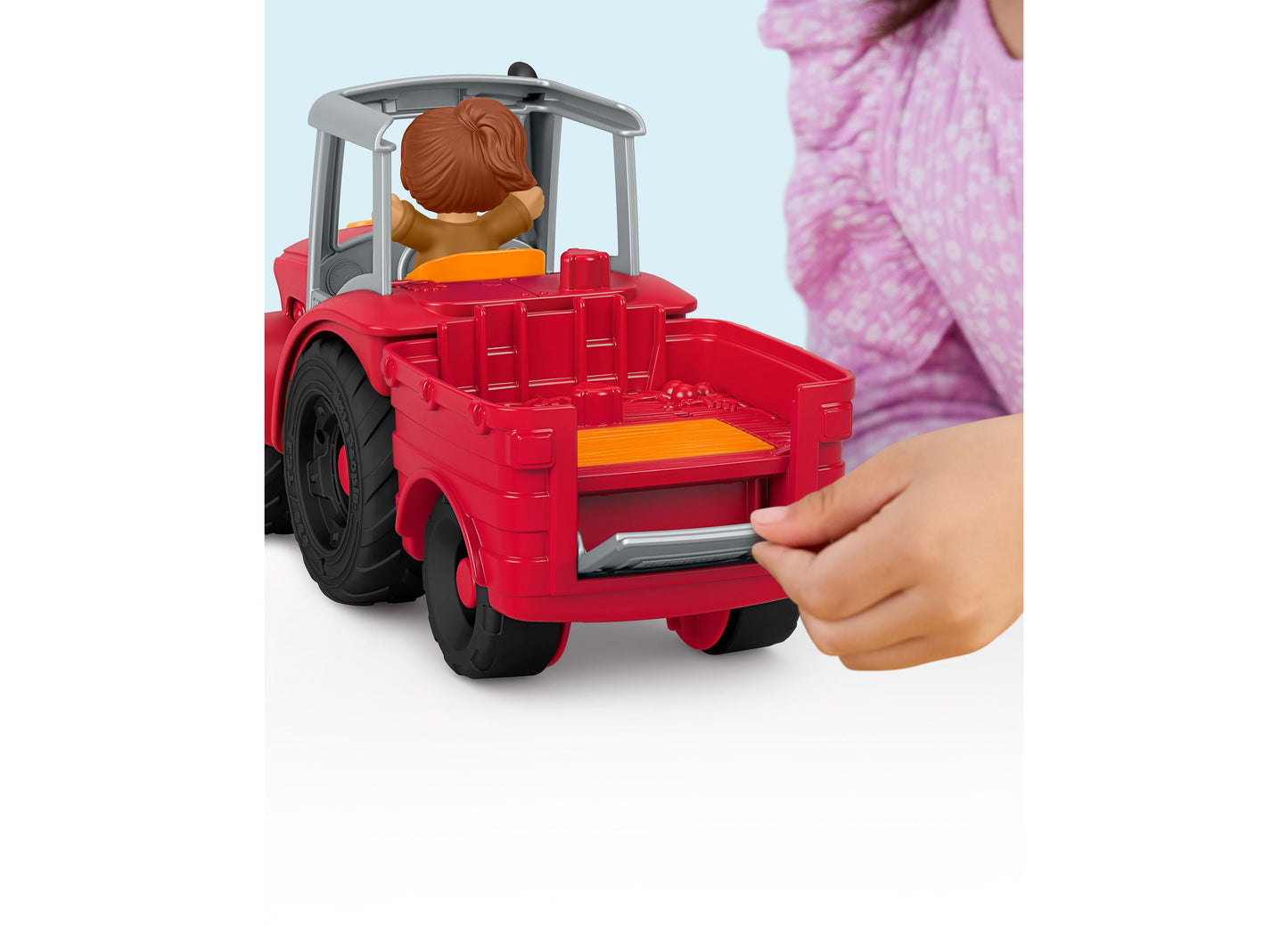 Fisher Price Little People Tractor playset with red farm vehicle and brown-haired figure