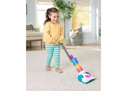 Fisher-Price Laugh & Learn 2-in-1 Vacuum toy in rainbow colors with child playing in bright living room