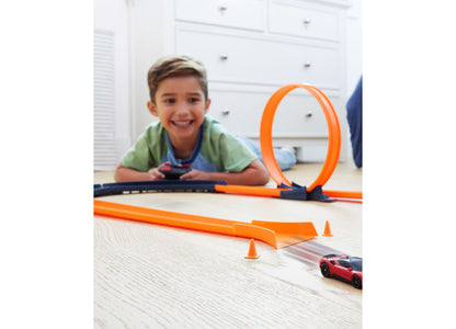Hot Wheels Ferrari SF90 Stradale red remote control car on orange track set with loop