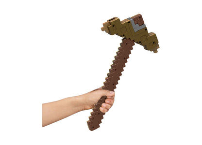 Minecraft Click and Switch 2-in-1 Sword and Pickaxe toy in brown, held in hand