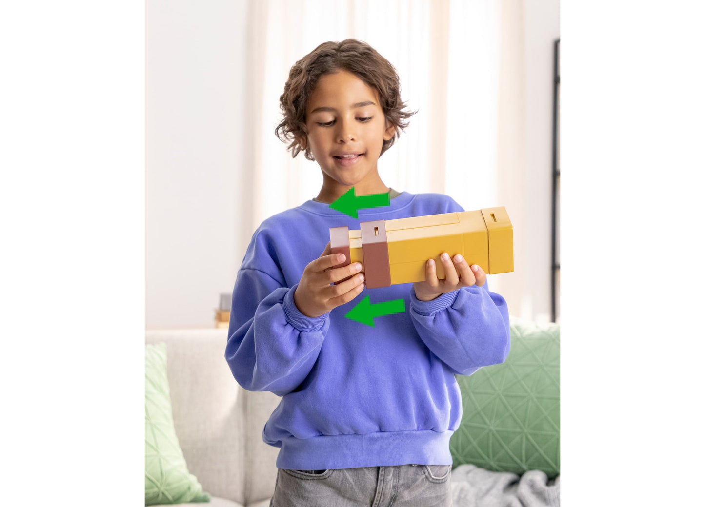 Boy holding yellow Minecraft Pixel Spyglass role-play toy