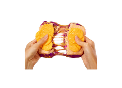 Slime Life Peanut Butter and Jelly with Chips Slime Kit being held and pulled apart
