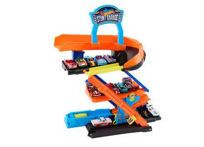 Hot Wheels Stunt Garage Playset with orange ramps, blue base, and die-cast cars