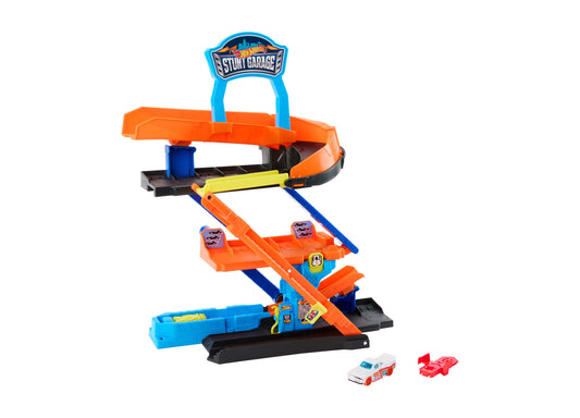 Hot Wheels Stunt Garage playset with orange and blue tracks, ramps, and two die-cast cars