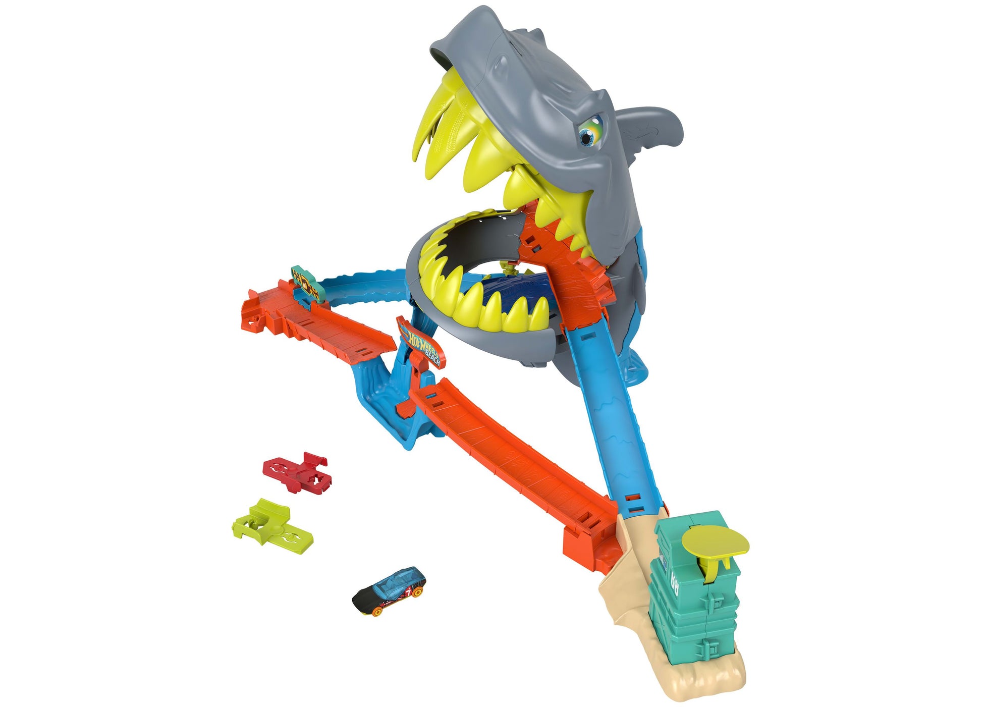 Hot Wheels City Shark Chomp Beach Playset with gray shark jaw structure, blue and orange track pieces, and small die-cast car