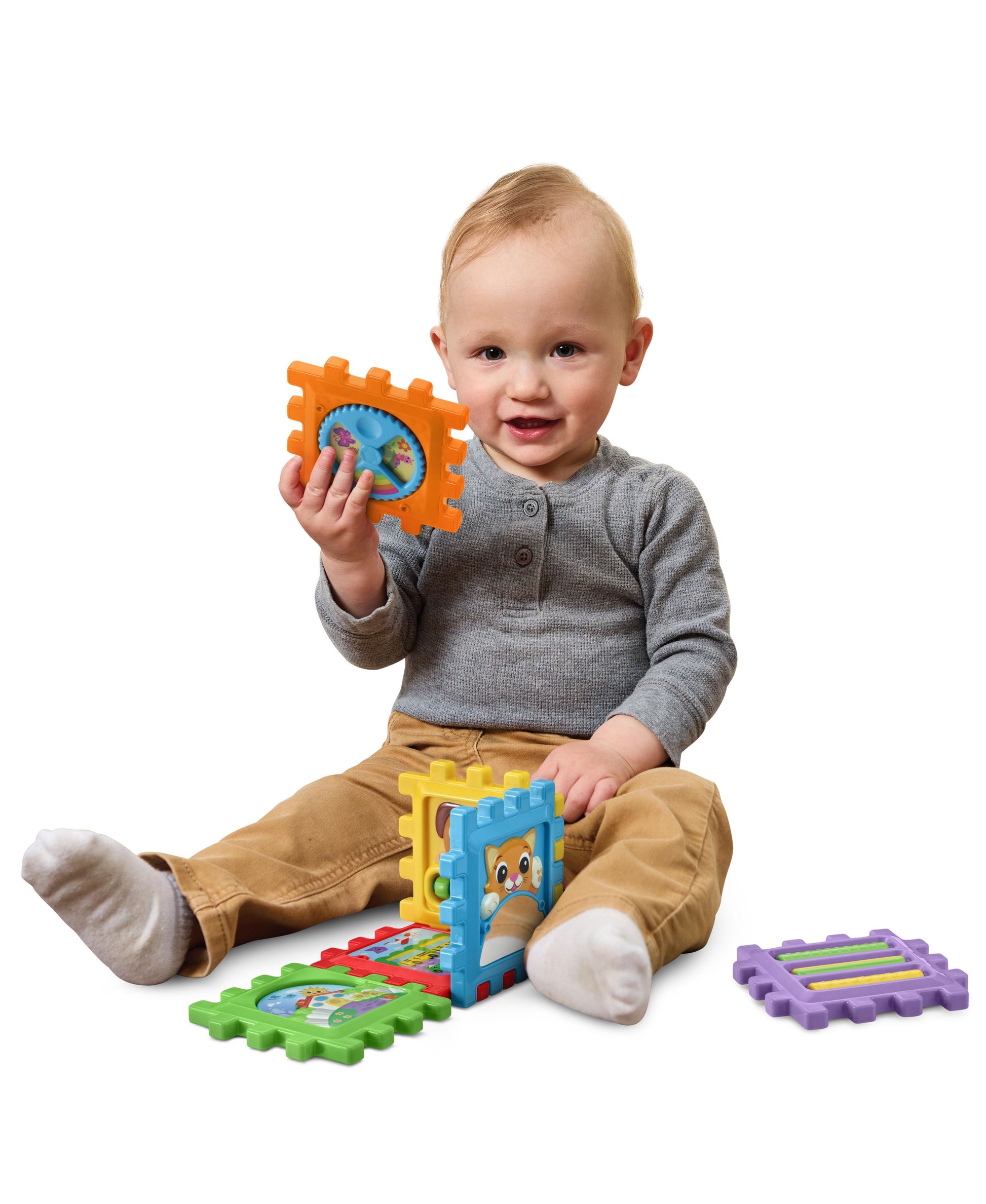 Leapfrog 6-in-1 Snap & Learn Busy Cube with colorful puzzle pieces in orange, blue, green, and purple